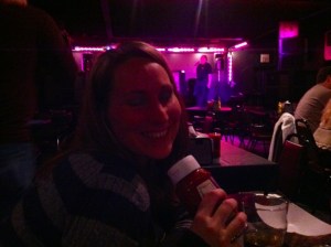 This was as close as Amanda was getting to karaoke. Love the action shot of the singer behind her though.