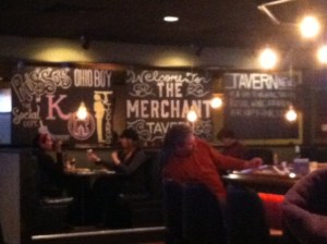 Photobomb by the guy in the red shirt falling off the barstool