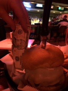 That burger is half a ten dollar bill. Size and money-wise. 