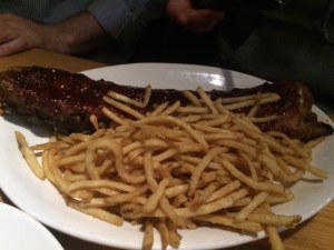 There's a rack of ribs under those fries somwhere